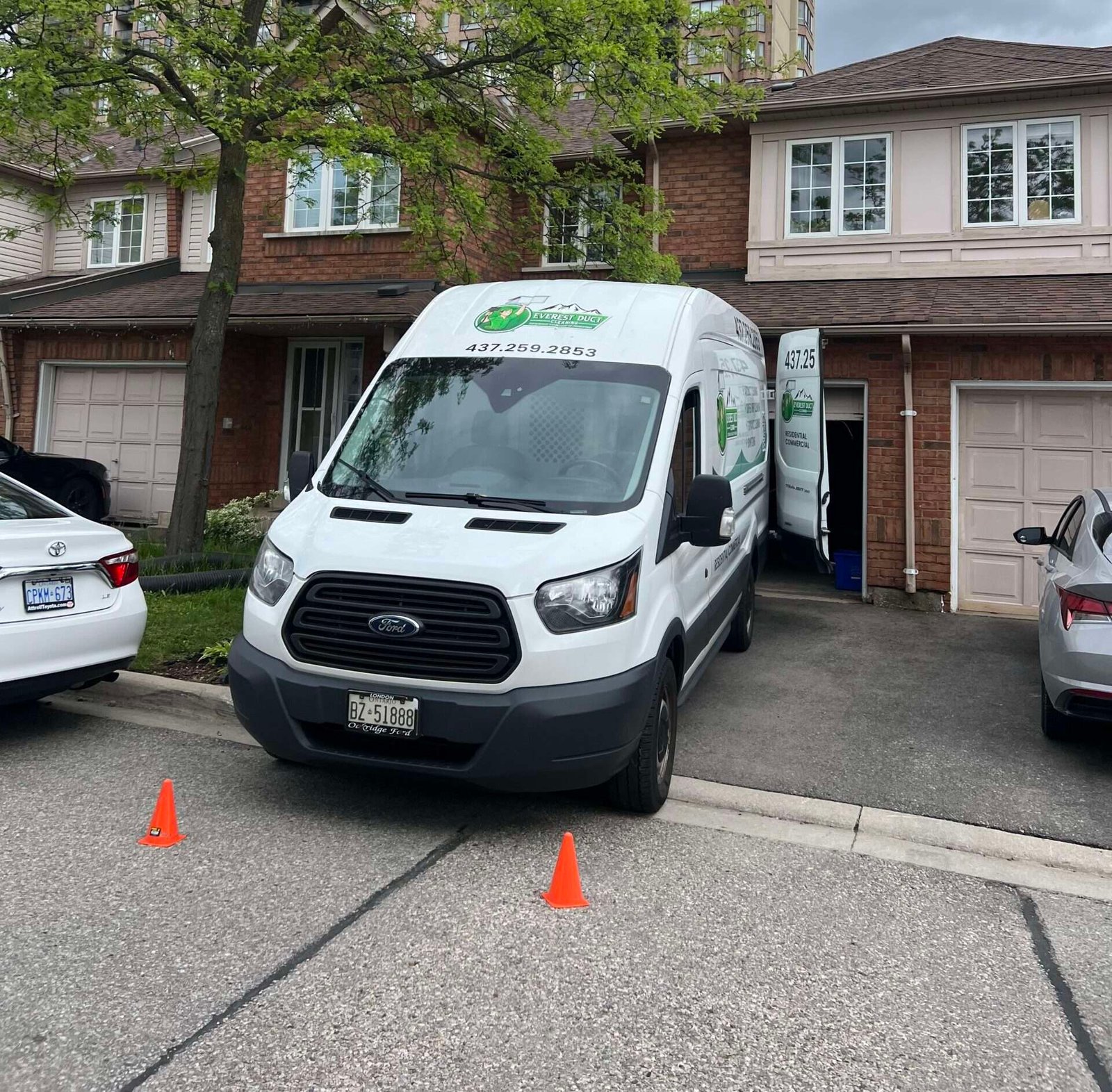 A white Everest Duct Cleaning ford van parked in front of a residential home in Brampton, Ontario, during a professional duct cleaning service.