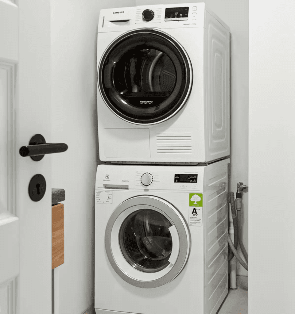 Technician cleaning a residential dryer vent for improved efficiency.