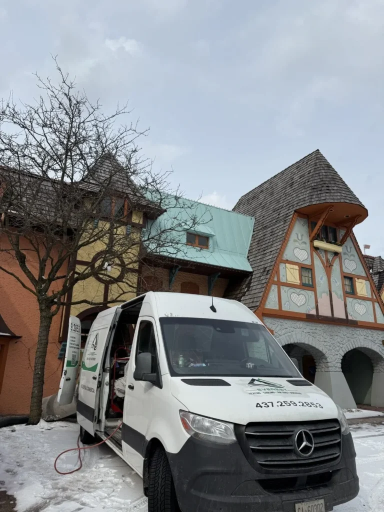 Everest duct heating and Cleaning Inc. van outside the commercial homes